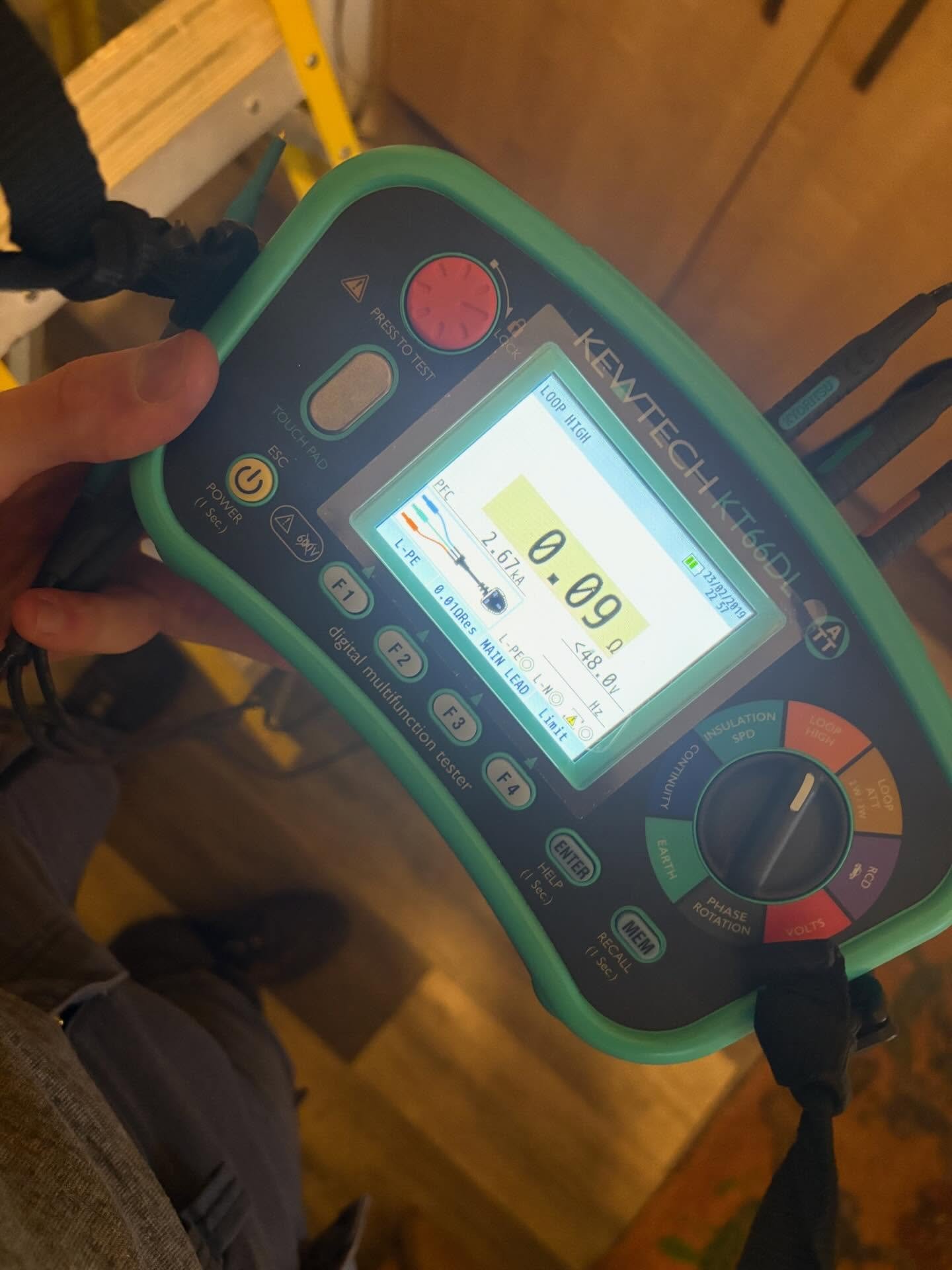Kewtech KT66DL multifunction tester on desk showing earth loop impedance measurement