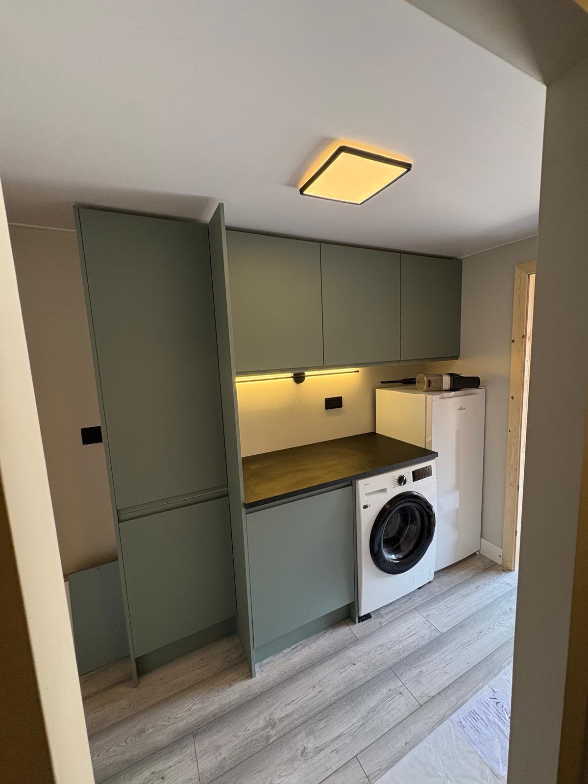 Utility room with flush LED ceiling panel, under-cabinet strip lighting and appliance sockets